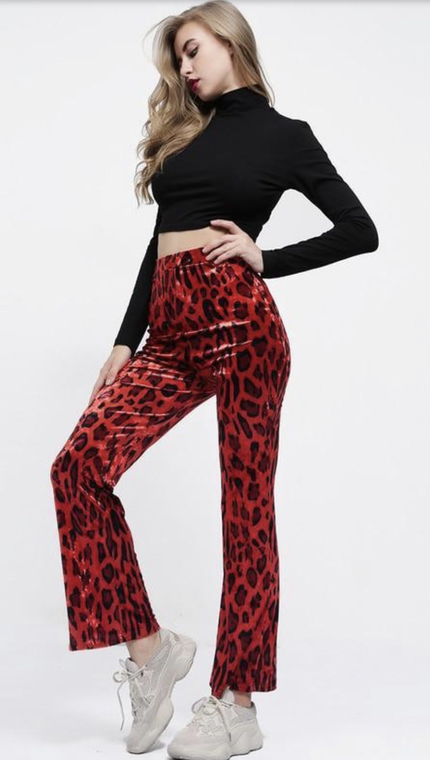 Dope Fashion Sense. Girl standing. red cheetah pants. red pants