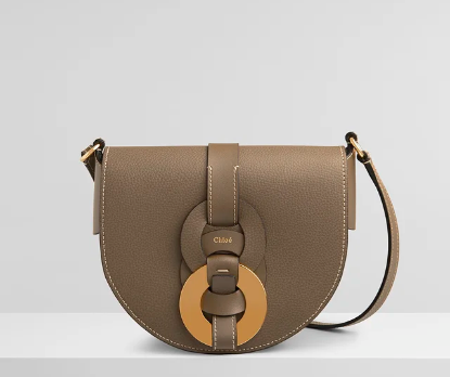 Stylish handbags for the winter season and winter outfits. Chloé Small Darryl saddle bag in small grain & smooth calfskin