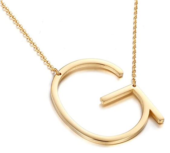 a gold necklace. a gold g necklace. a gold letter necklace.